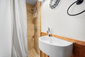 a bathroom with a white sink and a shower at Red Rock Ranch in Cosby +29 photos
