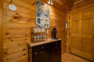 a cabin with a counter and a sign on the wall at Hidden Hideaway in Cosby +25 photos