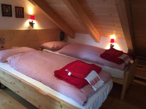 Postel nebo postele na pokoji v ubytování Mansarda Dolomiti
