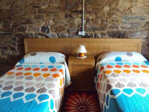 מיטה או מיטות בחדר ב-Casa de Lucas