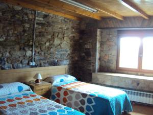 Postel nebo postele na pokoji v ubytování Casa de Lucas