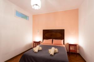Postel nebo postele na pokoji v ubytování Casa Iolanda