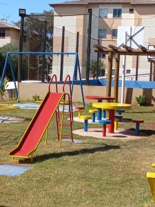 a playground with colorful play equipment in a park at Mi casa su casa 3 in Londrina