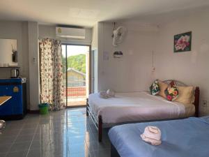 Postel nebo postele na pokoji v ubytování Jenny Hostel HuaHin + 37 fotografií