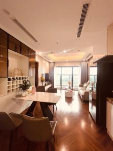 a kitchen and living room with a table and chairs at 2 Bedroom Luxury Apartment Diamond Crown Hai Phong in Ðông Khê