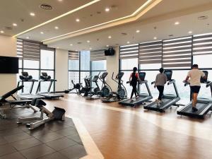 a group of people walking in a gym with treadles at 2 Bedroom Luxury Apartment Diamond Crown Hai Phong in Ðông Khê