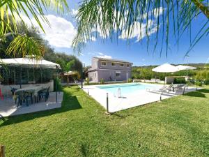 an image of a swimming pool in a yard at Villa with private pool in Floridia