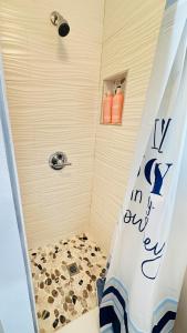 a shower with a shower curtain in a bathroom at Spacious Studio 10 mins to Mia&Downtown in Miami +33 photos