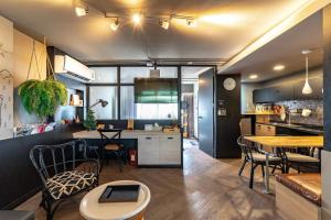 a kitchen and dining room with a table and chairs at Thip Residence at Surawong in Bang Rak