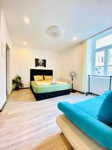 Ένα ή περισσότερα κρεβάτια σε δωμάτιο στο Chic 1BR Apartment Perfect for 3 Guests in Vienna