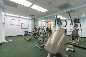 a gym with treadmills and elliptical machines at Capital Plaza Hotel in Frankfort