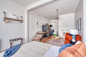 a bedroom with a bed and a staircase in it at Stay Portland - Bright Brooklyn Studio in Portland