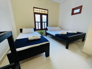 Postel nebo postele na pokoji v ubytování Natraj Guest House