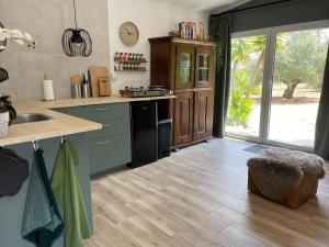 a kitchen with a sink and a counter top at Casa Olivero in Navarrés