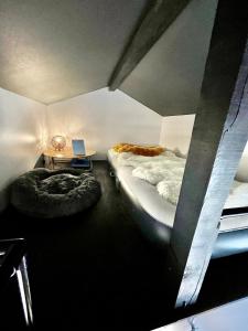 a room with two beds and a laptop on a table at 海宿ニシノヤ in Shioya