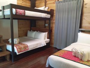 Postel nebo postele na pokoji v ubytování Naluyan Jungle Lodge