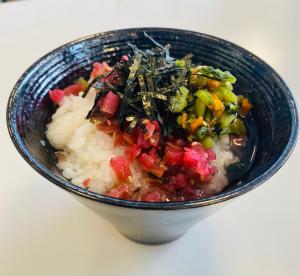 a blue bowl filled with vegetables and rice at Center Hotel Narita1 in Narita