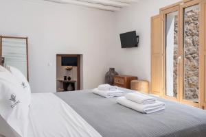 Postel nebo postele na pokoji v ubytování Pure Mykonos Villa