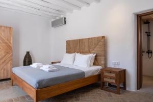 Postel nebo postele na pokoji v ubytování Pure Mykonos Villa