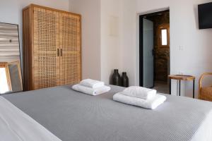 Postel nebo postele na pokoji v ubytování Pure Mykonos Villa