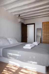 Postel nebo postele na pokoji v ubytování Pure Mykonos Villa