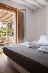 Postel nebo postele na pokoji v ubytování Pure Mykonos Villa