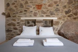 Postel nebo postele na pokoji v ubytování Pure Mykonos Villa