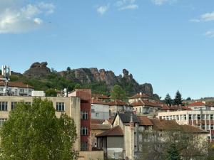 a group of buildings with a mountain in the background at Hotel17 in Belogradchik
