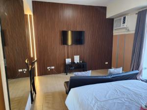 TV a/nebo společenská místnost v ubytování palm tree villas