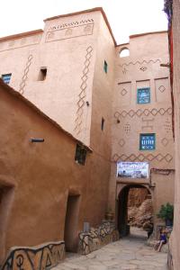 a building with graffiti on the side of it at Kasbah Maison D’hôte Lalla Zahra in Aït Baha