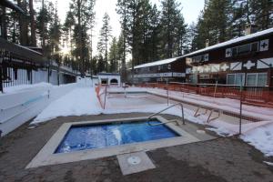 a swimming pool in the snow next to a building at HCC0612 - Sitzmark Ski Condo townhouse in South Lake Tahoe