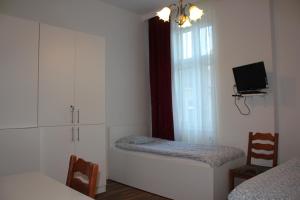Postel nebo postele na pokoji v ubytování Arnes Hotel Vienna