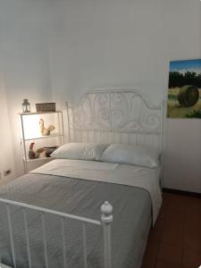 Postel nebo postele na pokoji v ubytování Casale Traiano