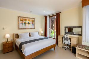 Postel nebo postele na pokoji v ubytování Casa Dewa Suite Villa Ubud