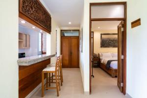 Postel nebo postele na pokoji v ubytování Casa Dewa Suite Villa Ubud