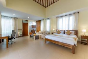 Postel nebo postele na pokoji v ubytování Casa Dewa Suite Villa Ubud
