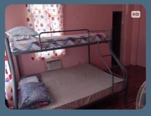 Postel nebo postele na pokoji v ubytování Josephine's Home Donsol