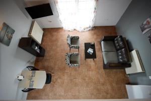 an overhead view of a living room with a couch and chairs at Μεζονέτα Aikaterini N1 in Chios