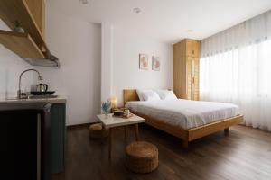 Postel nebo postele na pokoji v ubytování LATA Hotel & Apartments