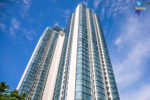 a tall building with a blue sky in the background at Anstay Residence by A La Carte Hạ Long in Ha Long