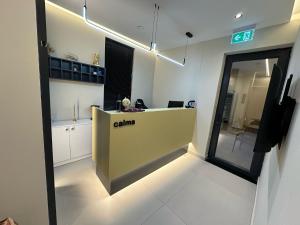 an office with a reception desk in a room at Calma Boutique Hotel in Vlorë