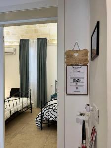 a room with a bedroom with a bed and a door at Bien-être Exclusive Apartment in Taranto +15 photos