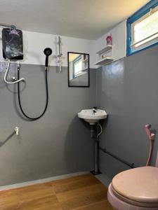 a bathroom with a shower and a sink at Liyaa Blue Beach Weligama in Weligama +9 photos