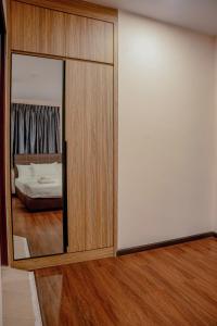 Postel nebo postele na pokoji v ubytování Palz Empire Hotel Temerloh + 2 fotografie