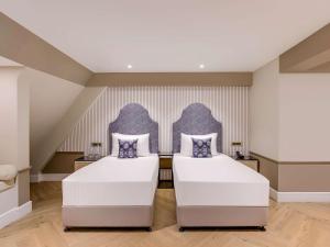 Grand Mercure Goa Candolim - An Accor Hotels Brand客房内的一张或多张床位