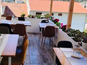 Reštaurácia alebo iné gastronomické zariadenie v ubytovaní B&B Buzolic