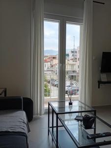 Postel nebo postele na pokoji v ubytování Elli Apartment Ermou 246