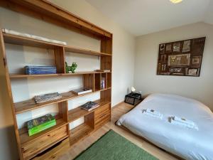 Postel nebo postele na pokoji v ubytování Le Gré d Argent grande maison au cœur des vignes