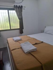 Postel nebo postele na pokoji v ubytování Jayshree Cottages