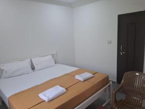 Postel nebo postele na pokoji v ubytování Jayshree Cottages